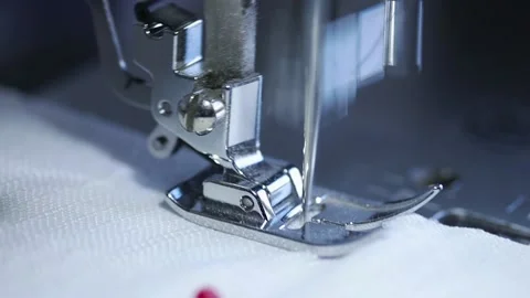 Close-up of sewing machine working with a white fabric. Stock Footage 225584303