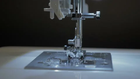 Close-up of a sewing needle moving in a sewing machine. slow motion Video stock 150467115
