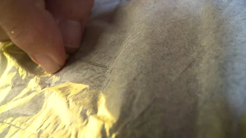 A Close-up of a sewing pattern being pinned down Stock Footage 311924117