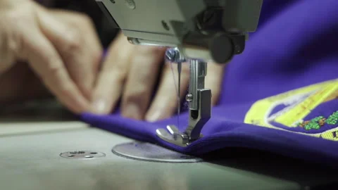 Close up of sewing process on the overlock in the sewing shop. Tailoring Stock Footage 201147967