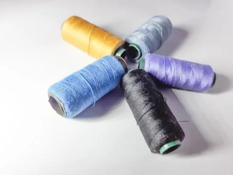 Close up sewing thread isolated white 스톡 사진