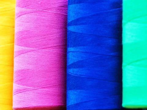 Close-up sewing threads multicolored background. Photos