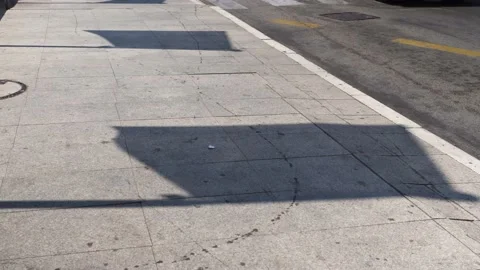 Close-up shadow from a large flag developing in the strong wind during the day Stock Footage 201676263