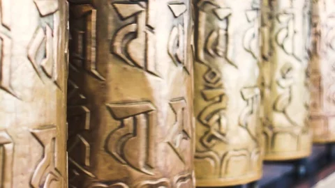 Close up shallow depth of feild shot of bhuddhist prayer wheel, golden drums Stock Footage 114653683