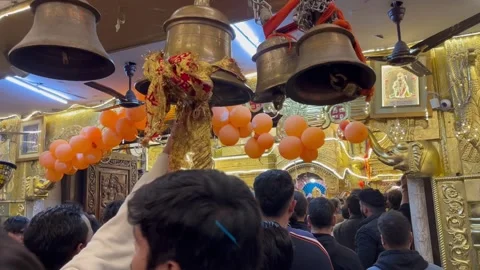 A close up shallow depth of field shot showing people inside an Indian temple ra Stock Footage 299789628