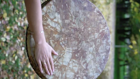 Close-up of a shaman's drum. Vertical video. Stock Footage 255973034