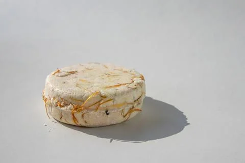 Close up of a shampoo bar with shadow on white background 库存照片