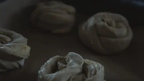 Close-up of shaped bread dough rolls arranged and ready for baking. Stock Footage 331857639