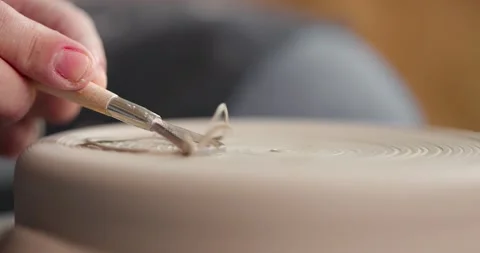 Close-up of shaping process of workpiece with a tool in a pottery studio. Clay Video stock 155653567