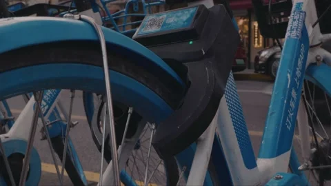 Close up of a shared bike automatically unlocking by bluetooth in Stock Footage 166686975