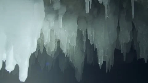 Close-up sharp ancient icicles inside a secret glacial cave eternal permafrost   Stock Footage 316588905