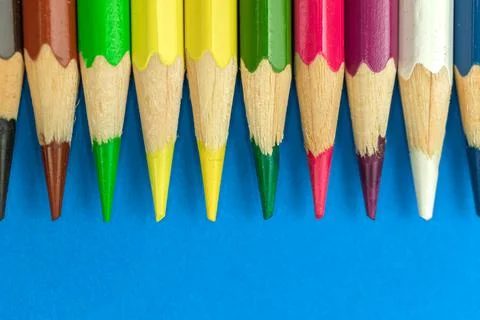 Close-up to sharp colour pencils, macro photography, blue background photo Stock Photos