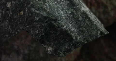 Close-up of a sharp-edged dark green stone Stock Footage 293685280