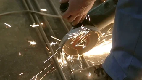 Close up of sharp metal corner grinding machine and a lot of sparks. Violation Stock Footage 77026678