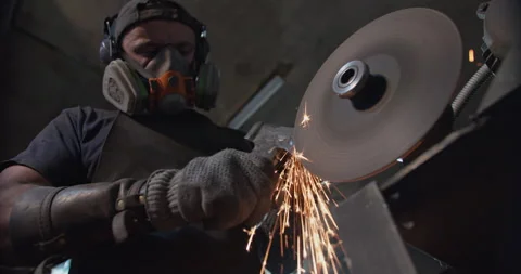 Close-up of sharpening an ax with sparks Video stock 144589131