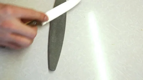 Close-up sharpening knife Stock Footage 85163618