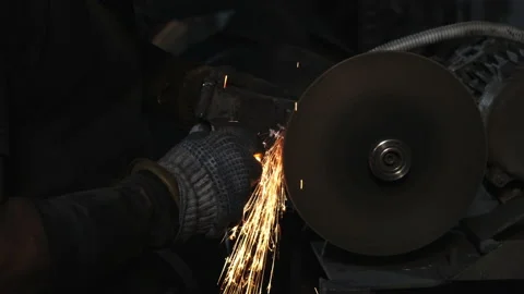 Close-up of sharpening metal with sparks. Worker in protective gloves Stock Footage 143462614