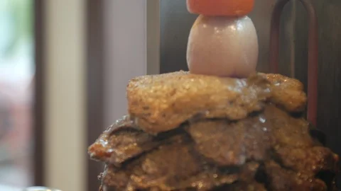 Close up shawarma meat on a spit spinning slowly 動画素材 108363308