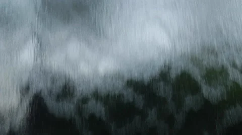 Close up of sheets of cascading water flowing from a glass fountain Stock Footage 49413692