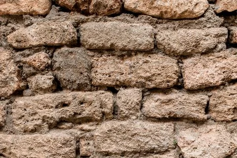 Close-up of shell rock block masonry at wall. Texture of natural stones. Stock Photos