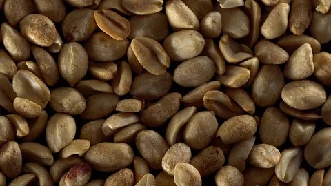 Close up of shelled peanuts rotating. Видео 70224537