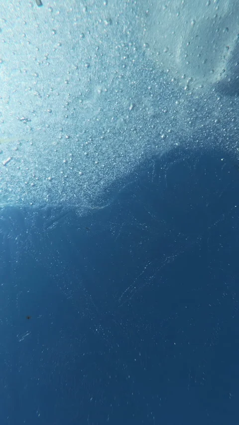 Close-up of shimmering, glass-like texture of ice as it glimmers in sun against Stock Footage 332855319
