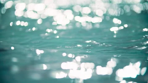 Close-up of shimmering water surface and lake waves Stock Footage 345589384