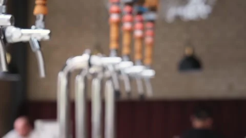 Close-up of shiny beer tap over unfocused background at brewery bar pub. Stock Footage 265911515