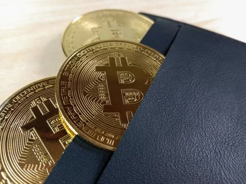 Close-up of shiny Bitcoins inside a wallet Stock Photos