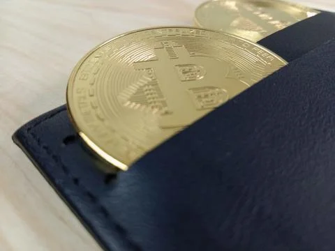 Close-up of shiny Bitcoins inside a wallet Stock Photos
