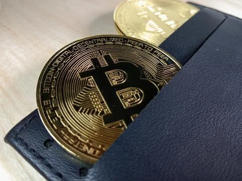 Close-up of shiny Bitcoins inside a wallet Stock Photos