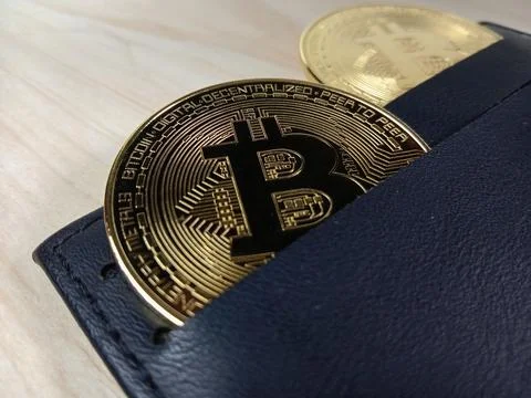 Close-up of shiny Bitcoins inside a wallet Stock Photos