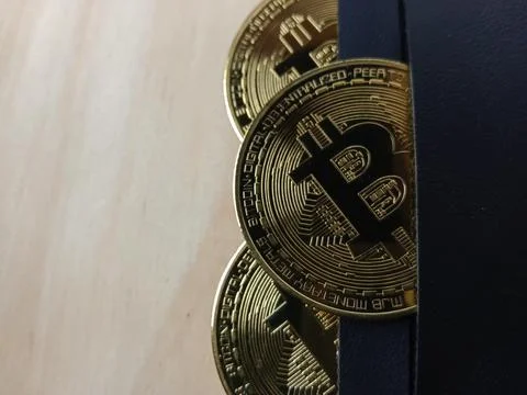 Close-up of shiny Bitcoins inside a wallet Stock Photos