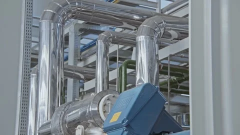 Close up of shiny clean pipe with elbow, branch and valve. Pipe flange joint Stock Footage 316143009