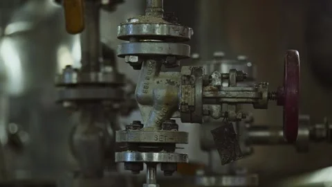 Close up of shiny clean pipe with elbow, branch and valve. Pipe flange joint Stock Footage 316143042