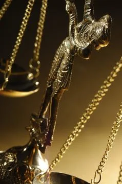 Close-up of shiny golden empty balanced vintage justice scales Atristic macro Stock Photos