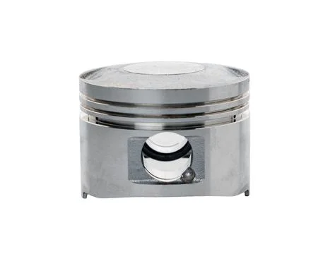 Close-up of a shiny silver engine piston. Metal rings, wrist pin hole, mach.. 스톡 사진