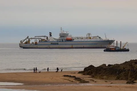 Close Up of Ship Next to Sandy Beach Stock Photos