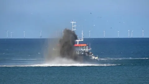 Close up of ship at sea dredging an excavation activity done in shallow water 4k Stock Footage 78038764