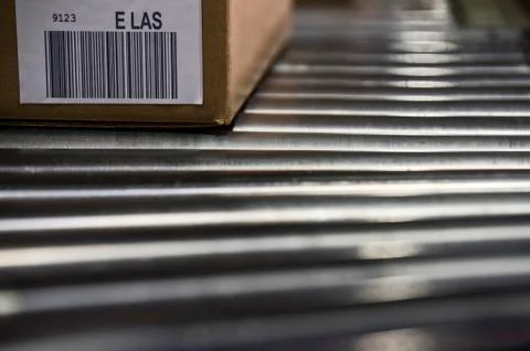 Close up of shipping labels with bar codes on cardboard boxes sitting on a Stock-Fotos