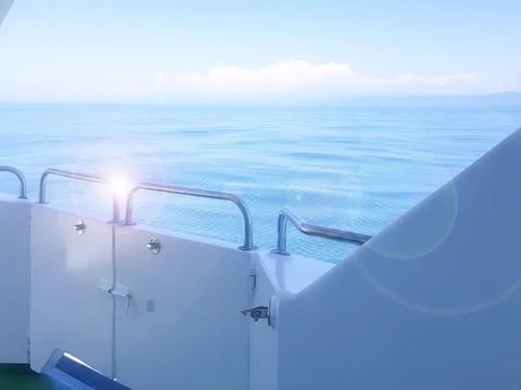 Close-up of the ship's side, the view from the deck of the yacht at dawn on t Stock Photos