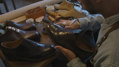 Close up shoe manufacturing workshop. Shoemaker sews shoes. Handmade work shoes Stock-Footage 137468477