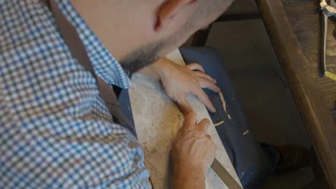 Close up shoemaker sews shoes to order. Shoe manufacturing workshop. Handmade Stock Footage 137579428