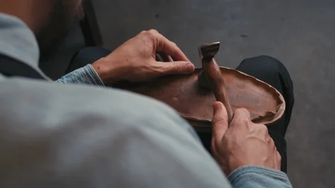 Close up shoemaker taps sole shoes with hammer. Workshop for production shoes Stock Footage 138280546
