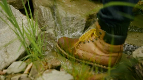 Close-up of shoes, man walking through brook in the forest, hiking 4K. Stock-Footage 234563308