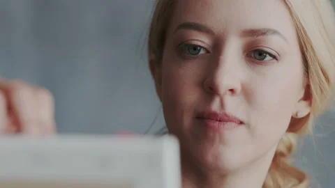 Close-up shoot. Attractive blonde gets pleasure from her hobbies. She has a very Stock Footage 106133131