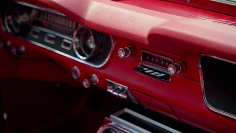 Close up shoot of the bright red interior dashboard and steering wheel of a 스톡 동영상 344028591