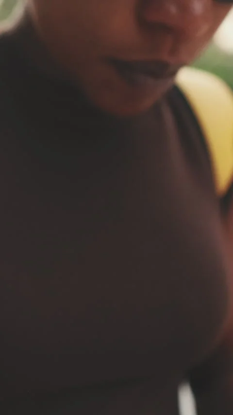 Close up shoot by camera moving from hands with phone to young women face Stock Footage 255505599