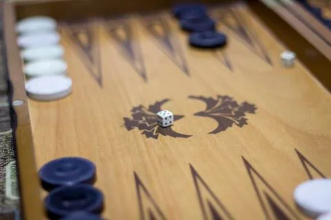 Close-up shoot of dice of backgammon under dim light Stock Photos