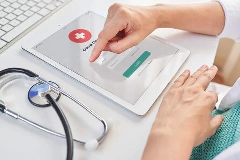 Close up shoot of a doctor's hands using a digital tablet Stock Photos